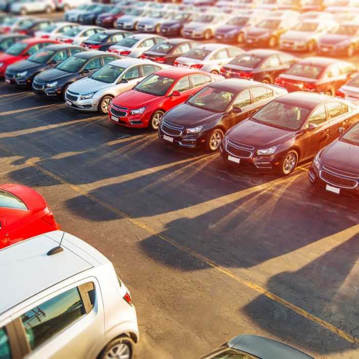 Dealer New Cars Stock Dealer New Cars Stock. Colorful Brand New Compact Vehicles For Sale Awaiting on the Dealer Parking Lot. Car Market Business Concept.